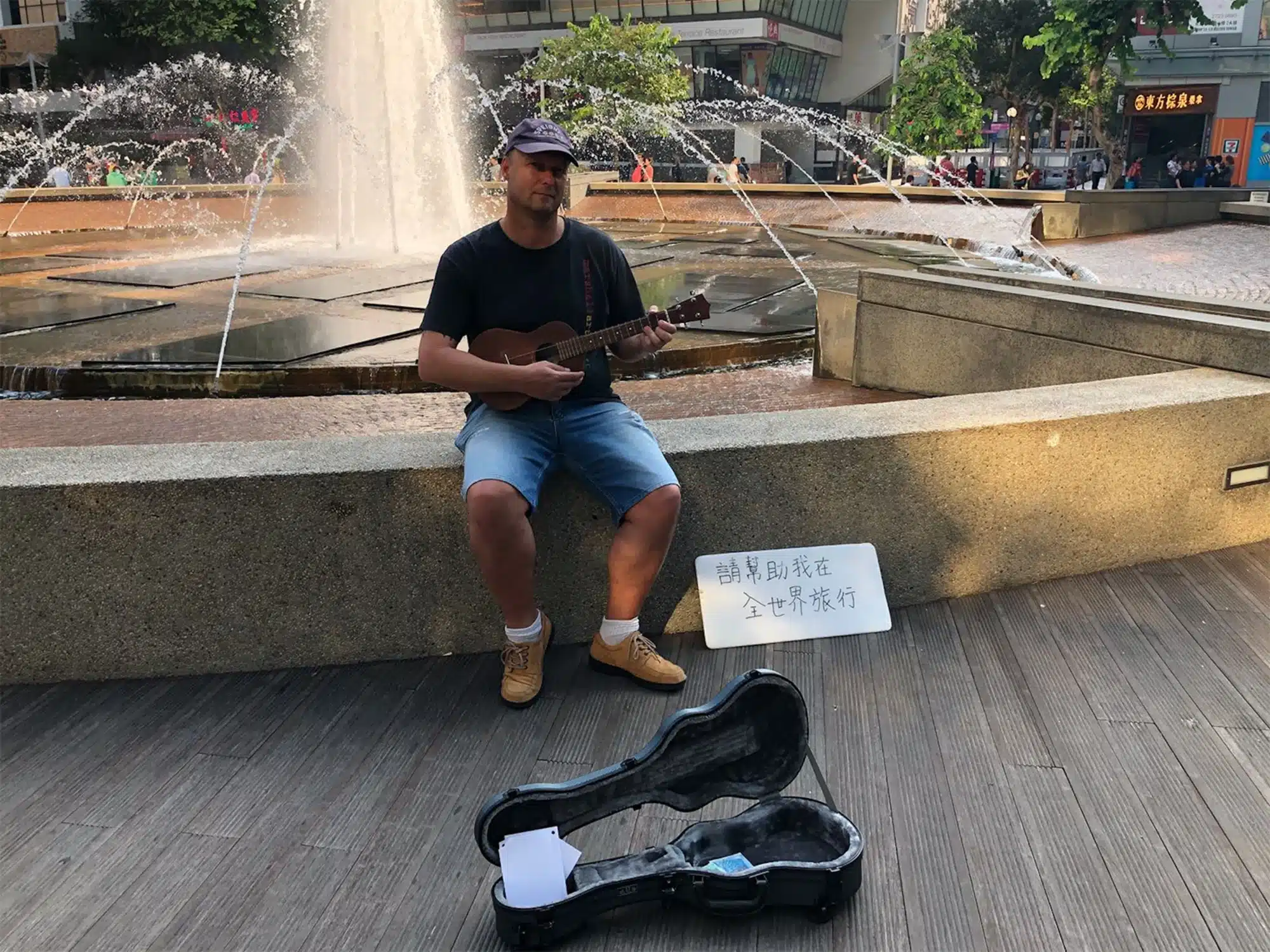 Professor Stephen Pratt, department chair of the Rosen College of Hospitality Management at the University of Central Florida, posed as a begpacker in Hong Kong and found that locals are more favourable towards those who busk or offer services | Photo taken from CNN and courtesy of Stephen Pratt