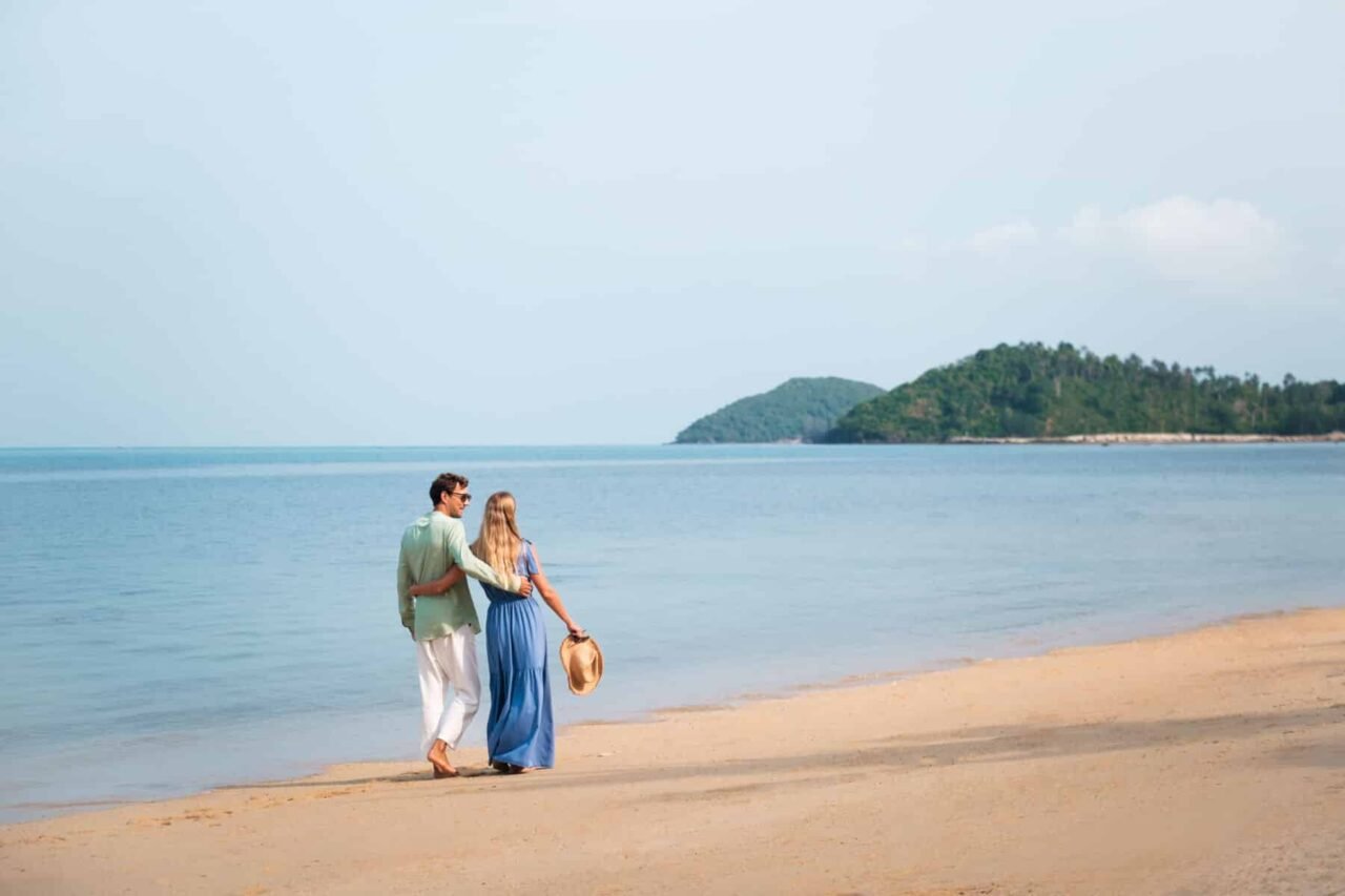 A couple walking on the beach