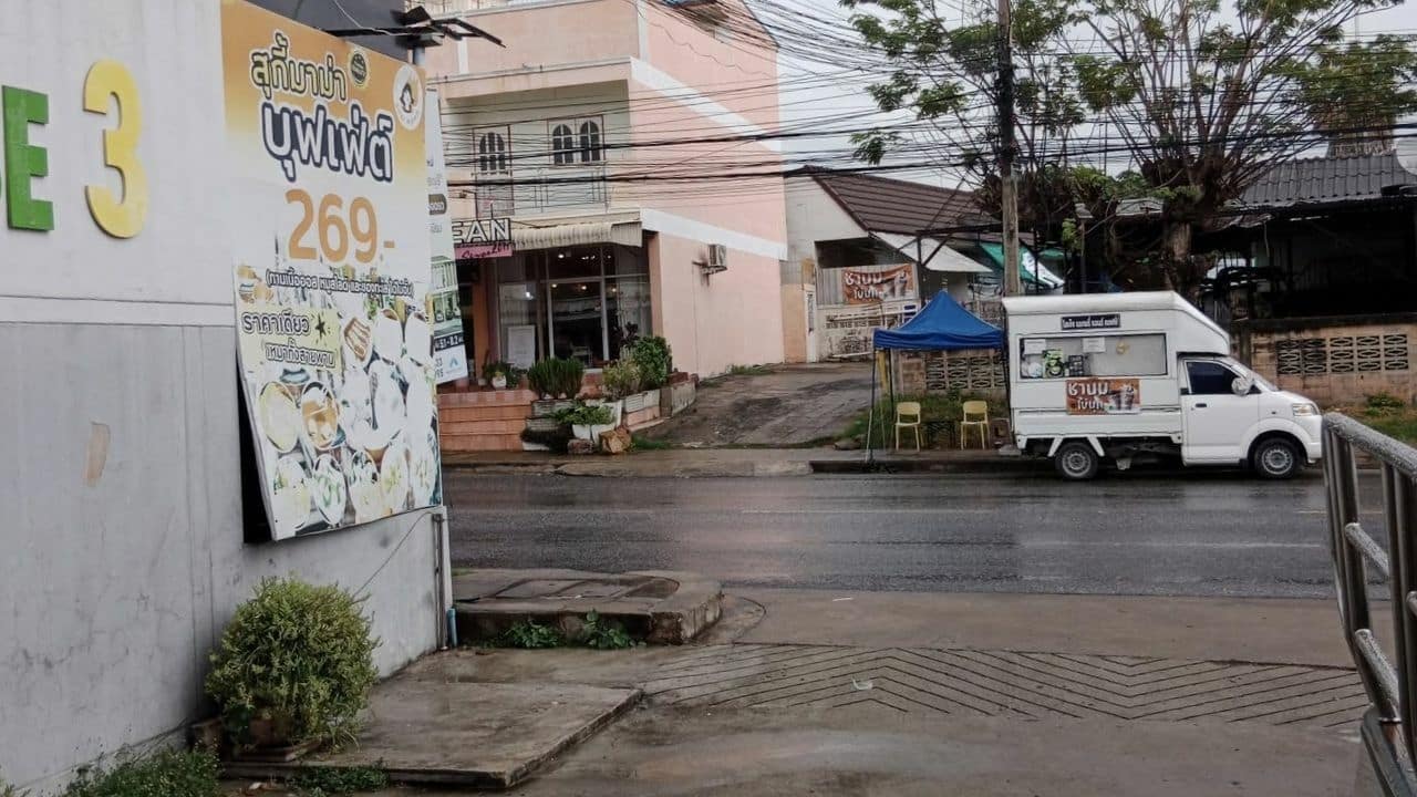 Thai man ditry road outside diamond store