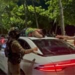 Drunk Indian tourist climbs taxi roof in Pattaya beach meltdown | Thaiger