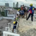 Chinese tourist rescued after rooftop water tank swim in Pattaya