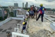 Chinese tourist rescued after rooftop water tank swim in Pattaya