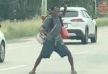 Homeless man’s martial arts dance stops traffic on Thai road