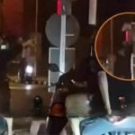 Phuket red mist: Daft foreign tourist climbs traffic light to go green