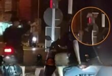Phuket red mist: Daft foreign tourist climbs traffic light to go green