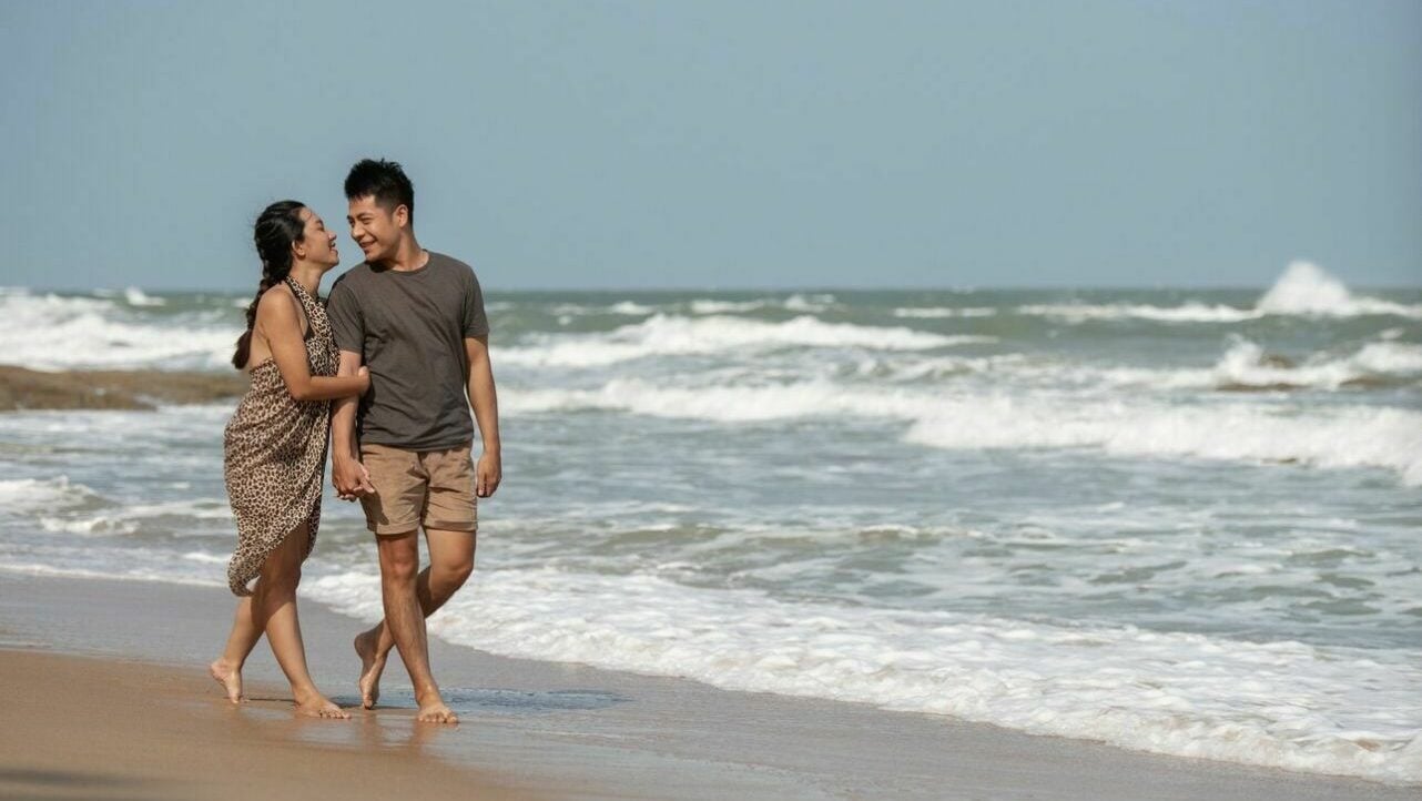 A couple walking on a beach