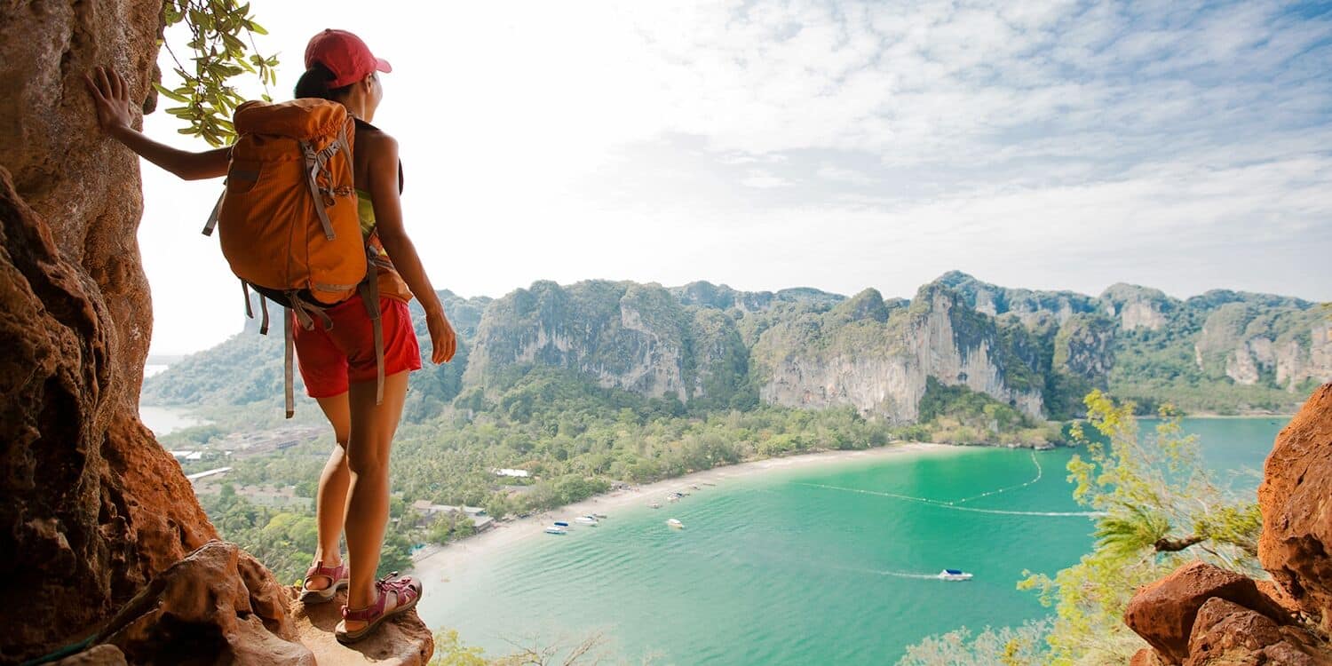 A backpacker overlooking Railay beach in Krabi | Photo taken from Travelzoo