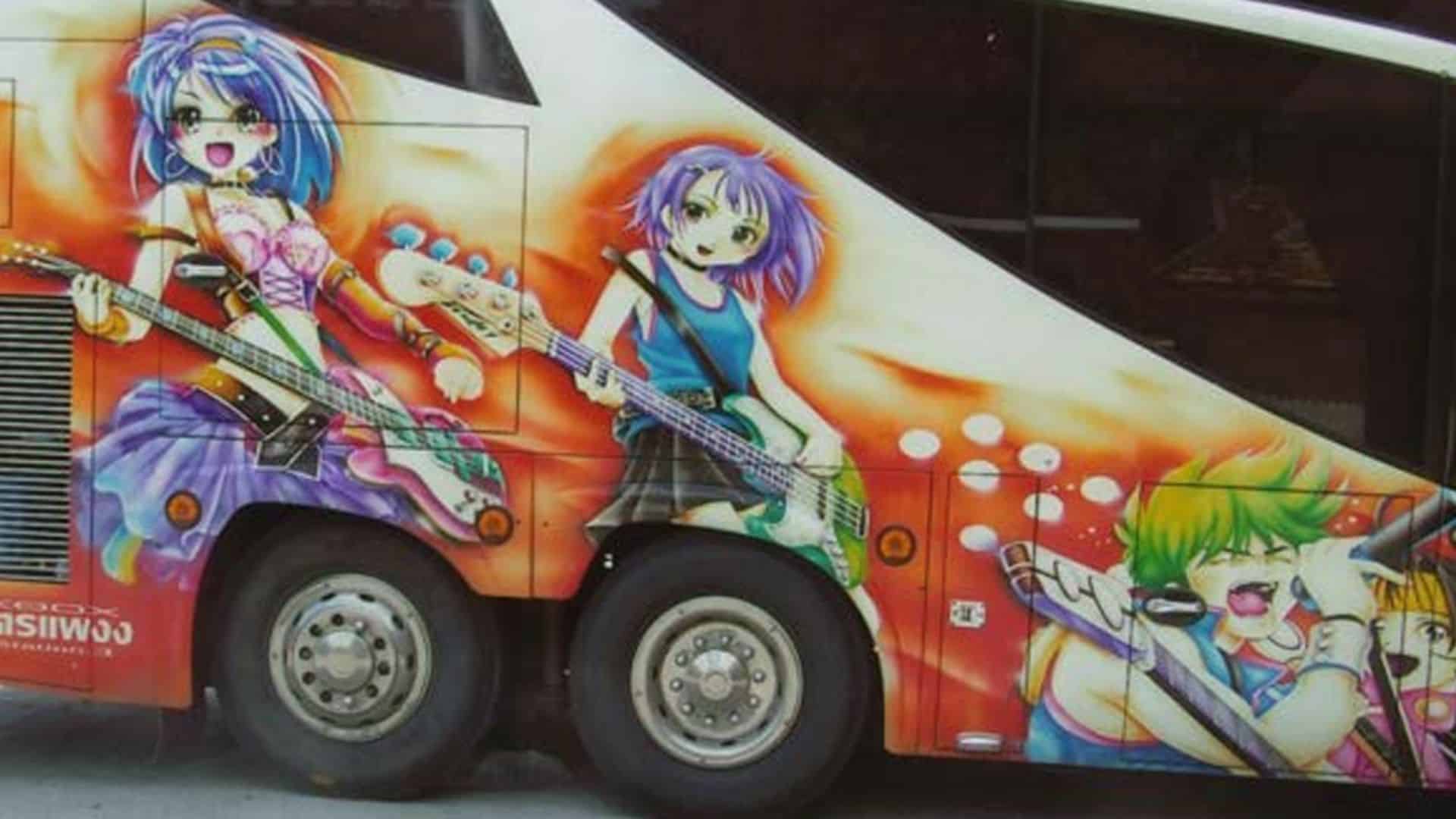 Thai charter/coach bus painted with three anime style girls in a band