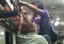 Thai woman attempts to kick fellow passenger off moving train