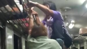 Thai woman attempts to kick fellow passenger off moving train