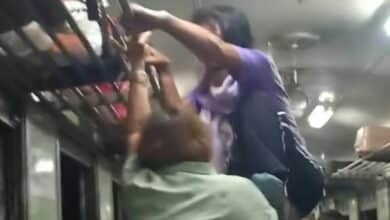 Thai woman attempts to kick fellow passenger off moving train