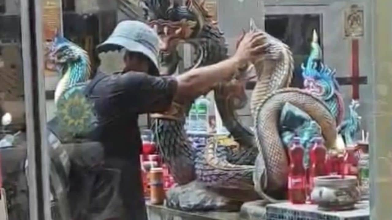 Foreign man caught on viral video kissing Naga statue in Phuket | News by Thaiger
