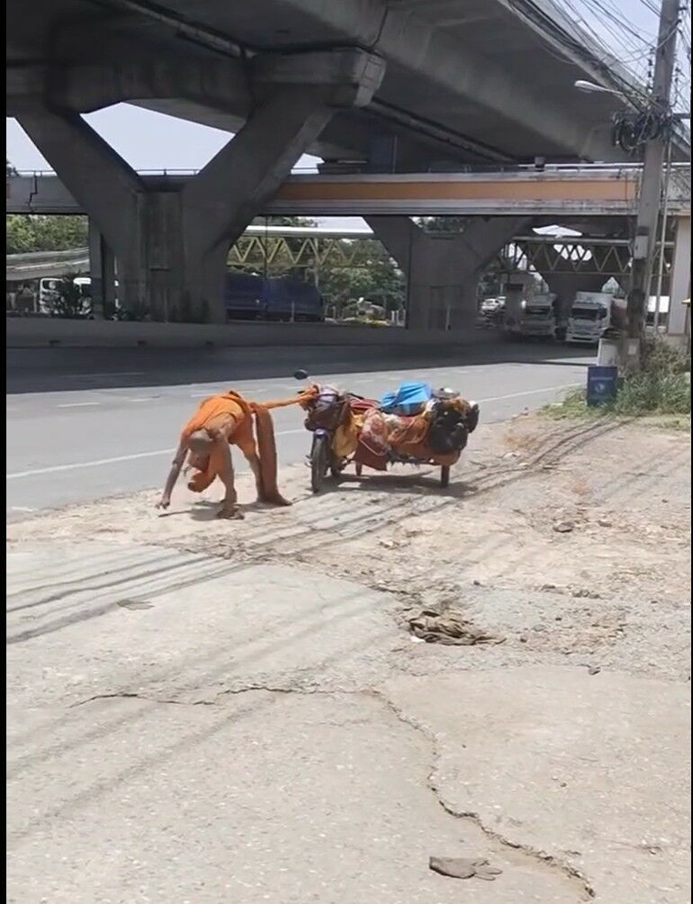 Imposter monk drags motorcycle along road in Korat (video) | News by Thaiger