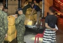 Drivers held for transporting 1,434 boxes of illegal cigarettes