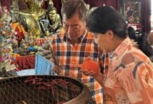 Woman wins 190,000 baht lottery after shrine visit