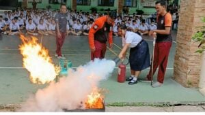 Class action: Thai schoolkids fight fire with fryer power