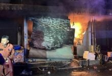 Fire engulfs Chon Buri shop, owner leaps from second floor