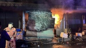 Fire engulfs Chon Buri shop, owner leaps from second floor