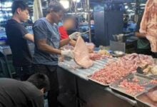 Ham-fisted: Cambodian couple busted for illegal pork stall in Bangkok