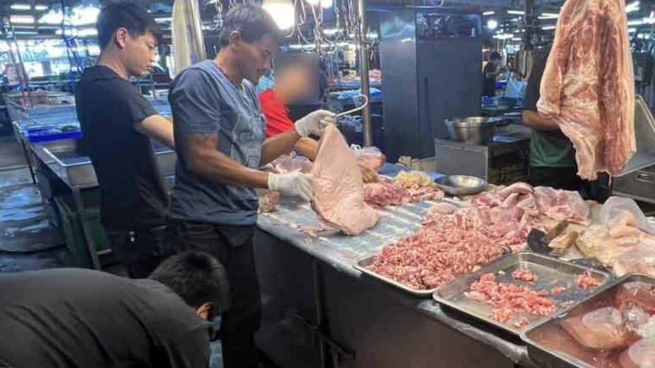 Ham-fisted: Cambodian couple busted for illegal pork stall in Bangkok