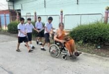 Nonthaburi monk rescued after wheelchair falls into canal