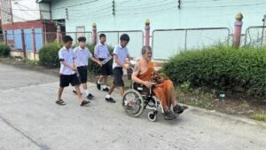 Nonthaburi monk rescued after wheelchair falls into canal