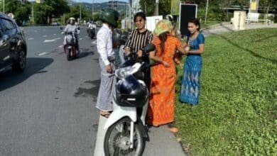 Close shave: Phuket cops rescue woman after scarf snags (video)