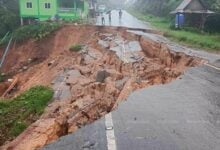 Mud, sweat, fears: Thailand landslide warning after monsoon soak