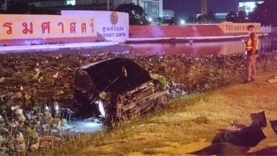 Pickup and sedan plunge into pond after collision near Thammasat | Thaiger