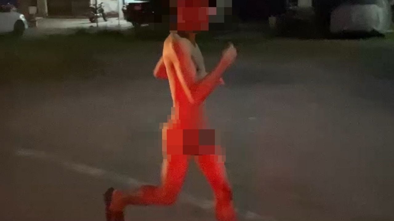 Thai man runs naked