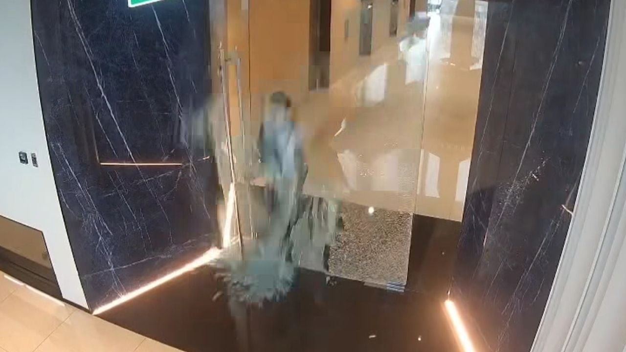 Thai woman injured by broken glass door at condo