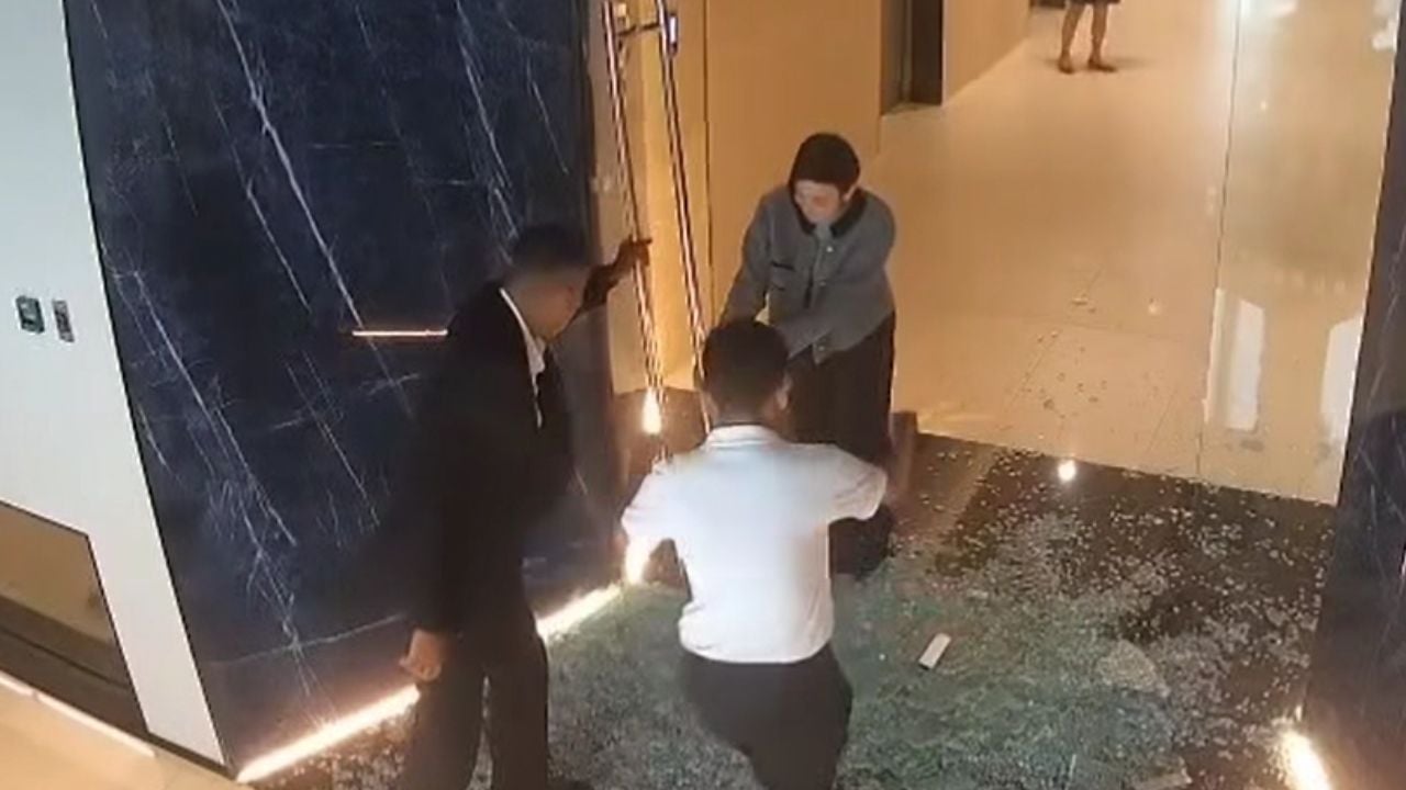 Thai woman seeks responsibility from condo owner after shattered glass door injured her