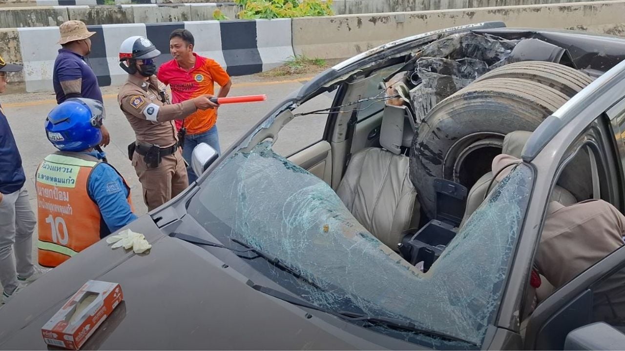 truck wheel smashes car roof on Pathum Thani