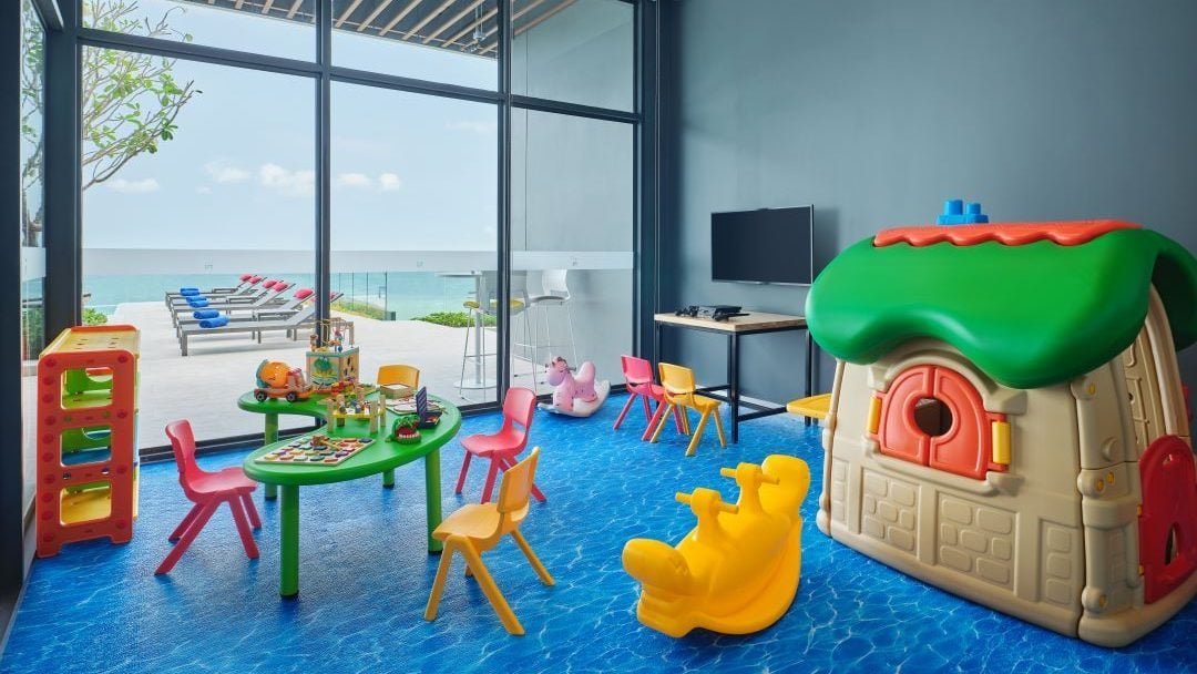 Colourful indoor kids' playroom with ocean view at Novotel Marina Sriracha