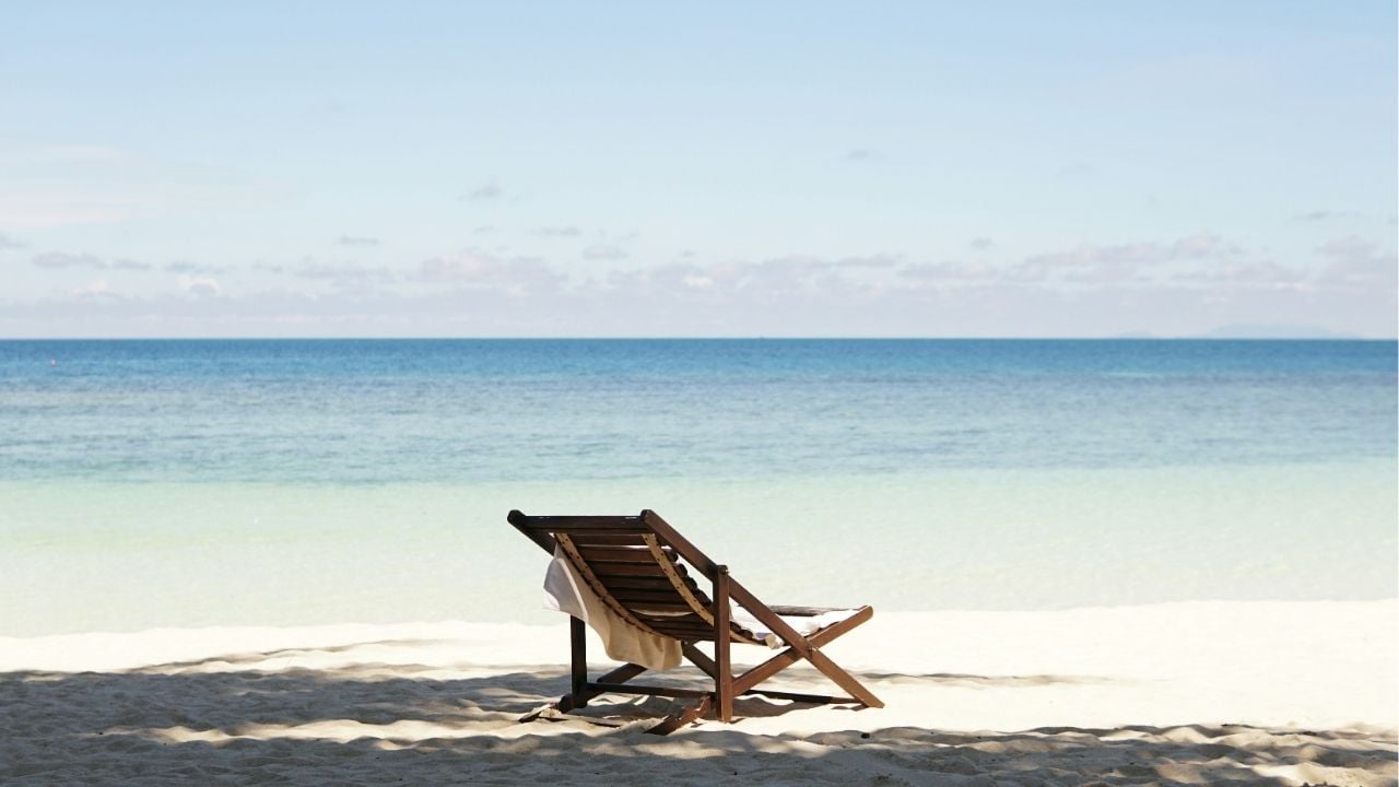 A lone chair on a beach at Haad Yao in Koh Phangan | Photo by Chen Mizrach on Unsplash