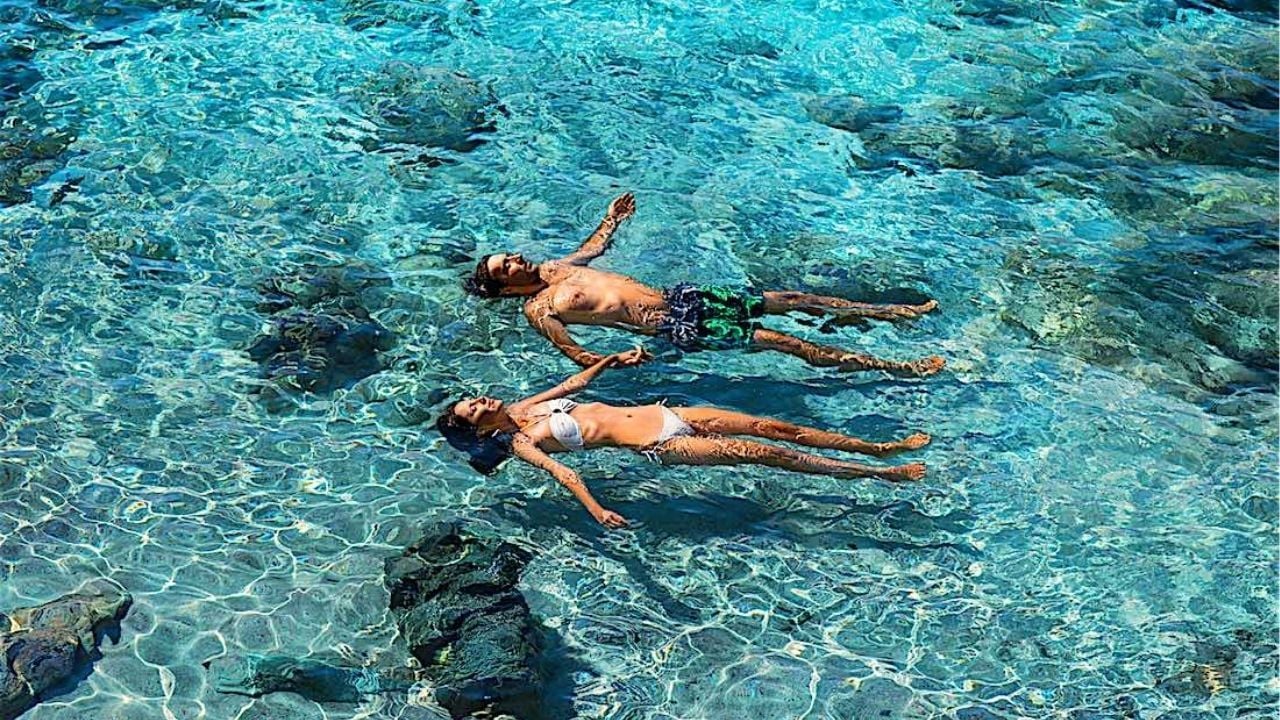 Couple having a swim | Photo taken from Black Turtle Dive website
