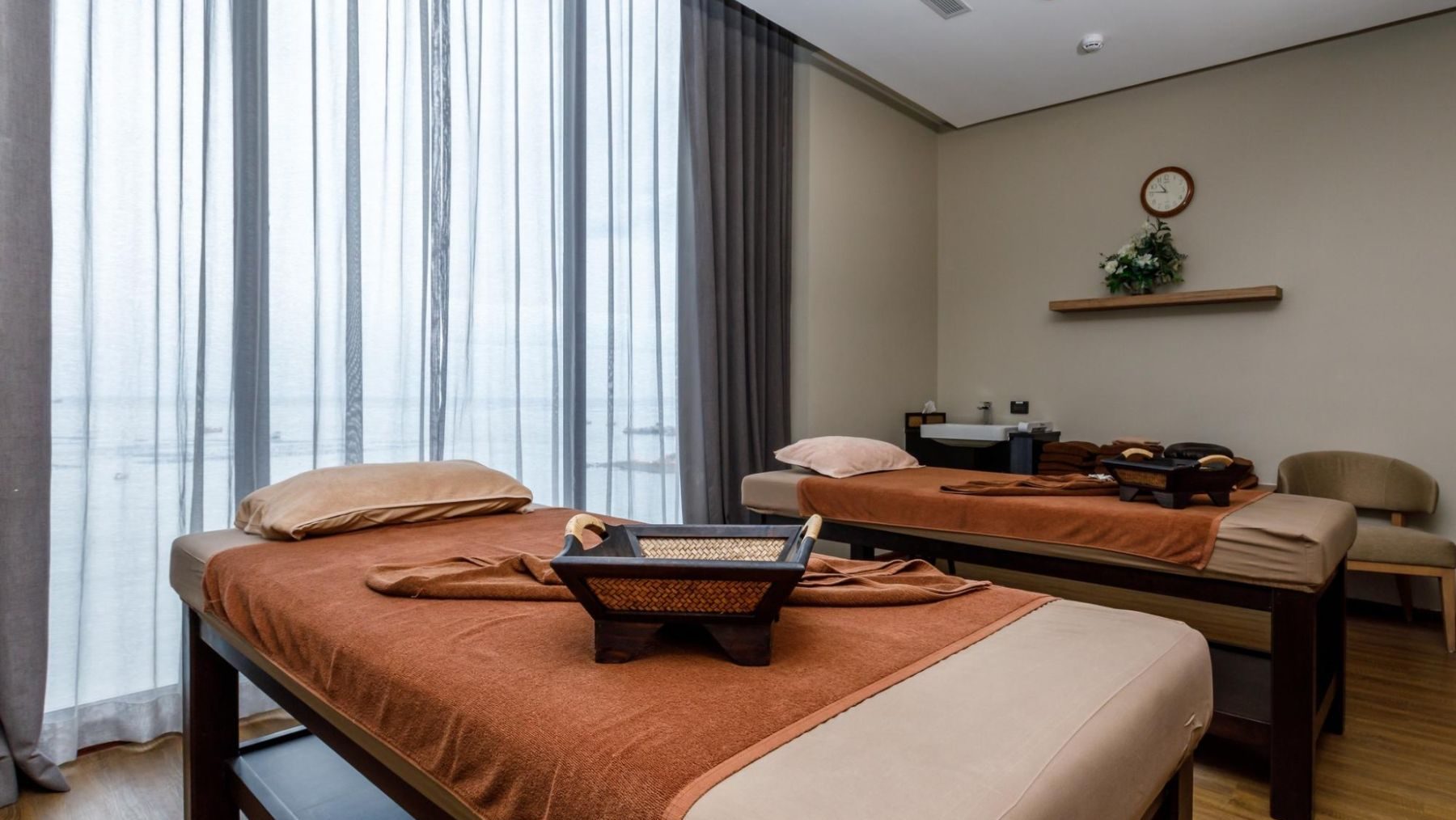 Peaceful spa treatment room with ocean view for rainy season travels at In Balance Spa Thailand