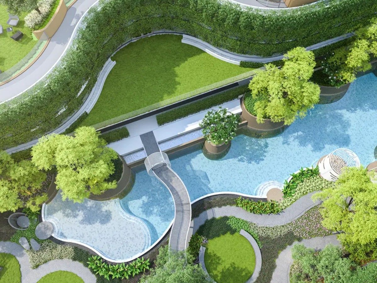 Lagoon-style swimming pool surrounded by landscaped gardens at Arise Vibe Phuket