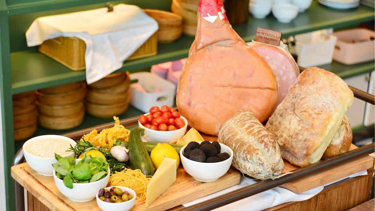 The showcase of the cold cuts, bread, cheese, and various ingredients