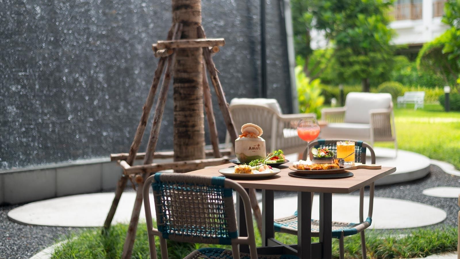 The outdoor dining space of Amaya Food Gallery inside a hotel in Thailand