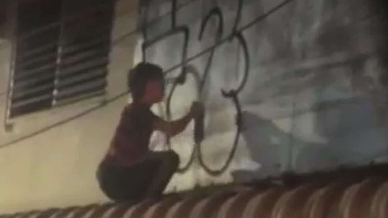 Foreigners spray Phuket building