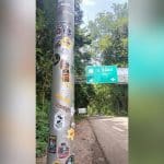Tourists face fines for defacing Kanchanaburi road sign | Thaiger