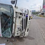 Delivery truck flips on wet Sri Racha road, driver injured | Thaiger