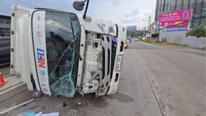 Delivery truck flips on wet Sri Racha road, driver injured | Thaiger
