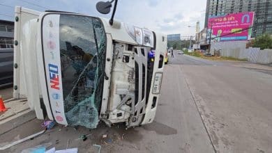Delivery truck flips on wet Sri Racha road, driver injured | Thaiger