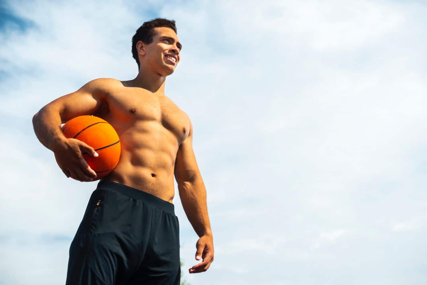 A man holding a basketball