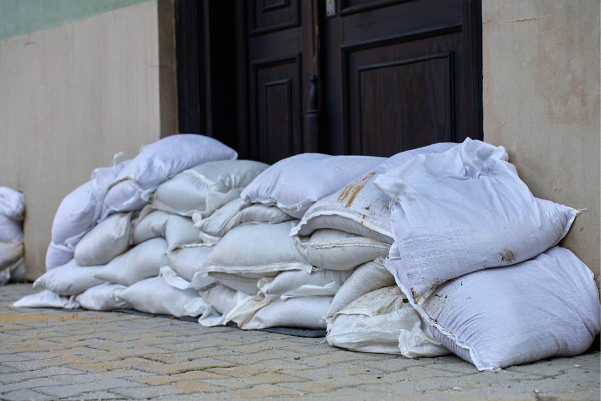 Sandbags lined up against a home's doorway
