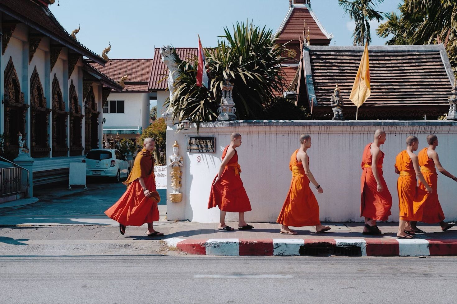 Monks walking through the Old City of Chiang Mai, capturing the essence of Northern Thailand in winter.