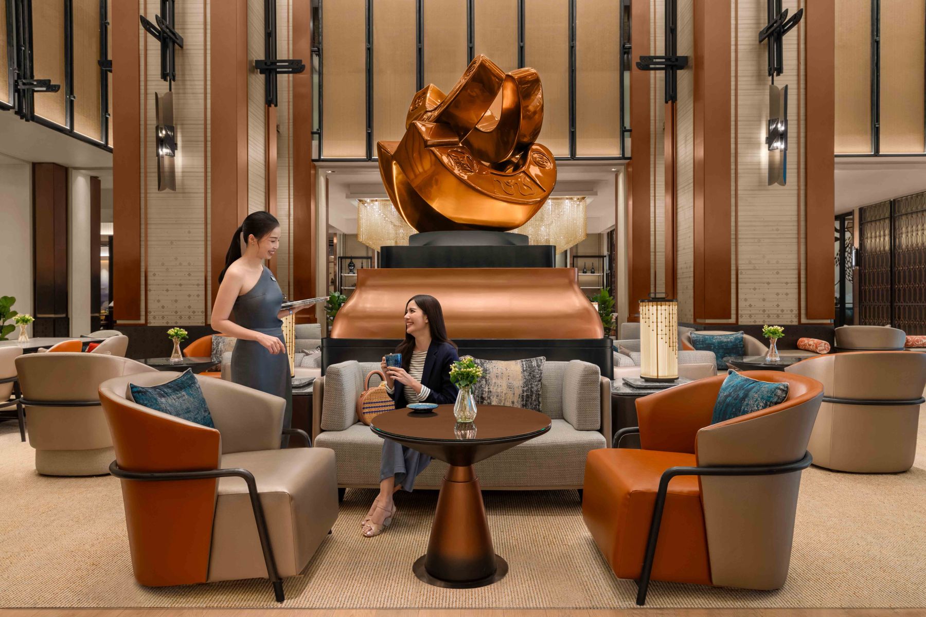 Hotel staff providing personalized service, emphasizing Chiang Mai's hospitality.