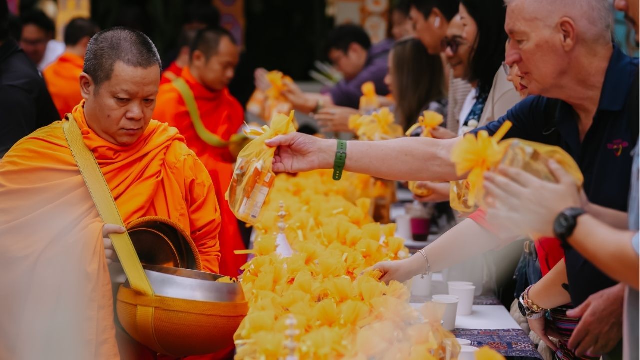 Hotel guest of the Mrriot Chiang Mai participating at the Tak Bat